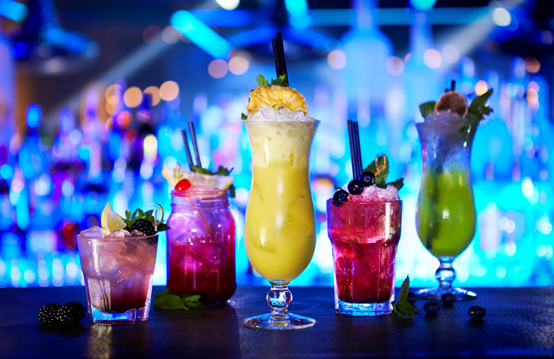Colourful cocktails on a nightclub bar